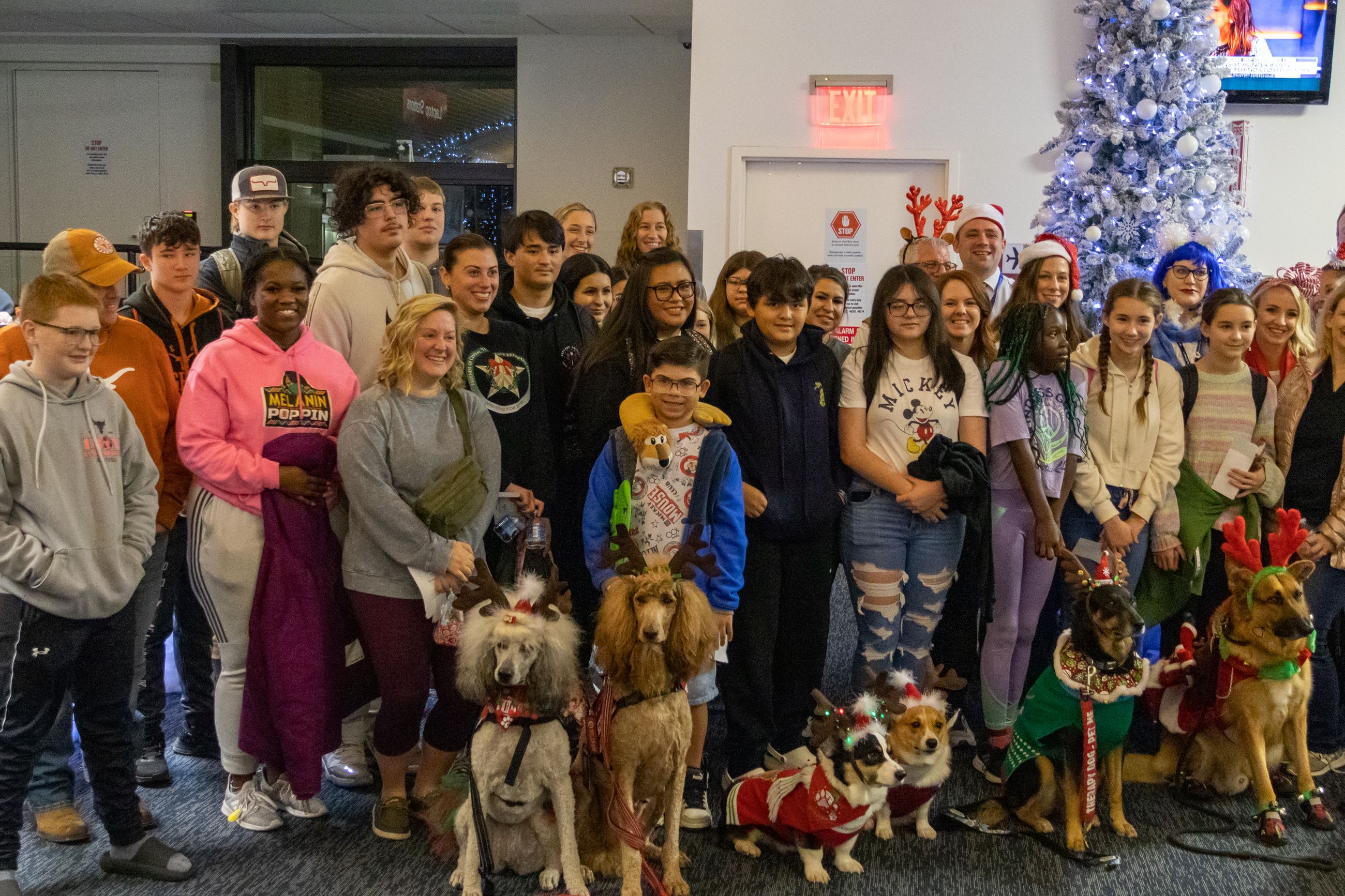 Gold Star Families pose with officials and volunteers before Snowball Express flight to Disney World