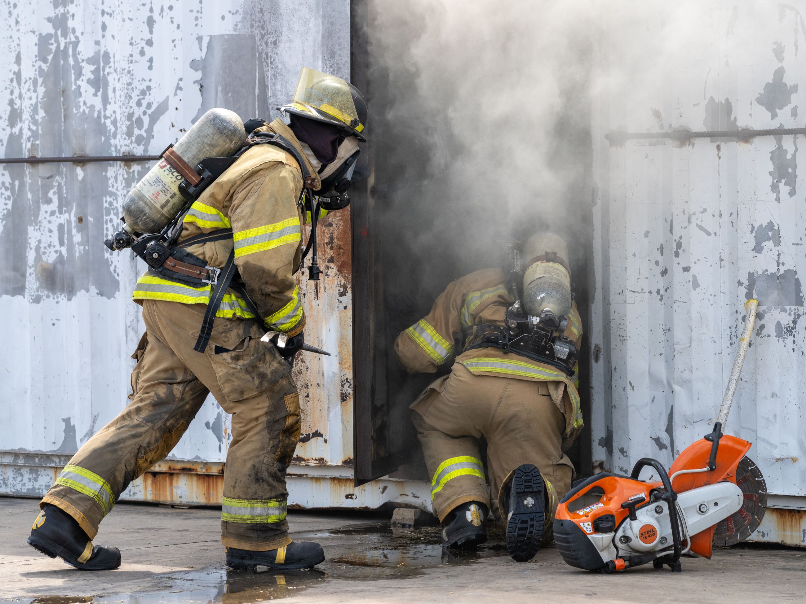 Firefighters in gear going into smoke (JPG)